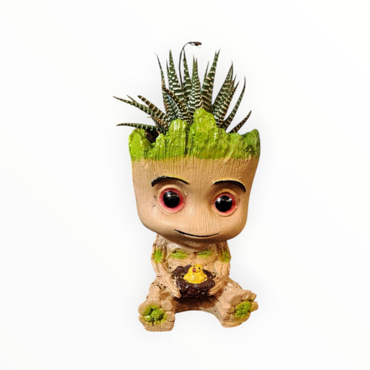 MyPlantMyTaste Baby Groot planter with Zebra Haworthia succulent, featuring red eyes and holding a yellow bird in a nest.