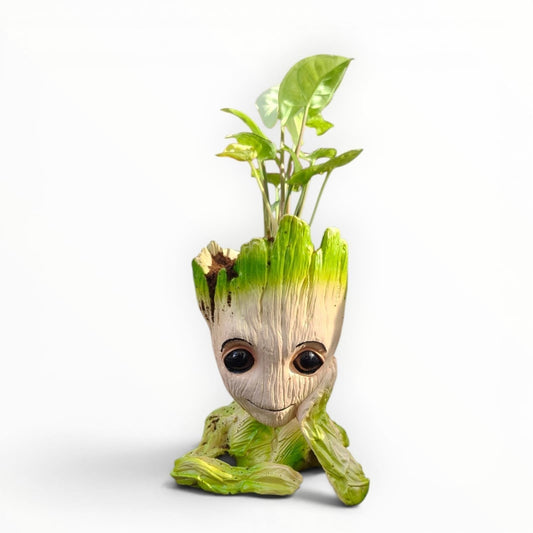 MyPlantMyTaste Syngonium plant in a cute, resin Groot planter with green accents and large black eyes.